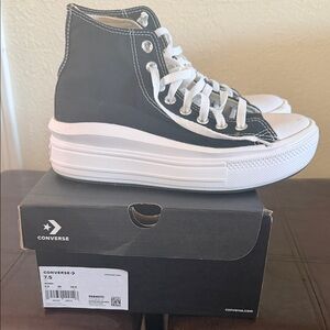 Converse Black and White High-Tops
Used once !